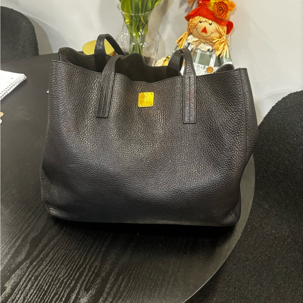 MCM black and gold reversible all leather tote